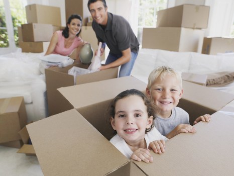 Packed moving boxes and furniture ready for transport in Croydon