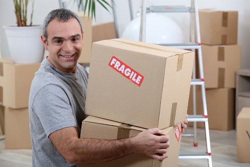 Professional movers handling office furniture in Croydon