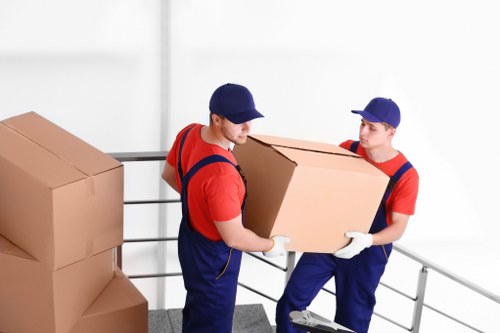 Removal team handling house move in Croydon residential street