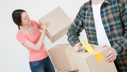 Removal team handling furniture safely during a planned move