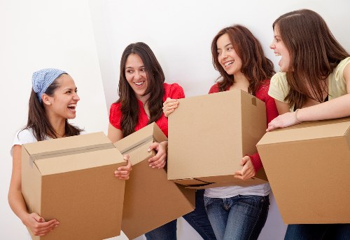 Local moving van loading boxes and furniture in Croydon