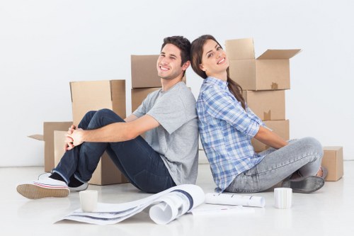 Business movers handling office equipment in a Croydon building